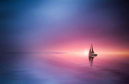 Sailing across the lake toward the sunset