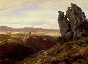 Low mountain range landscape with ruins of a castl