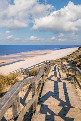 Wooden path to the west beach in Kampen