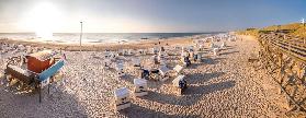 Beach chairs on the Rote Kliff in Kampen at sunset