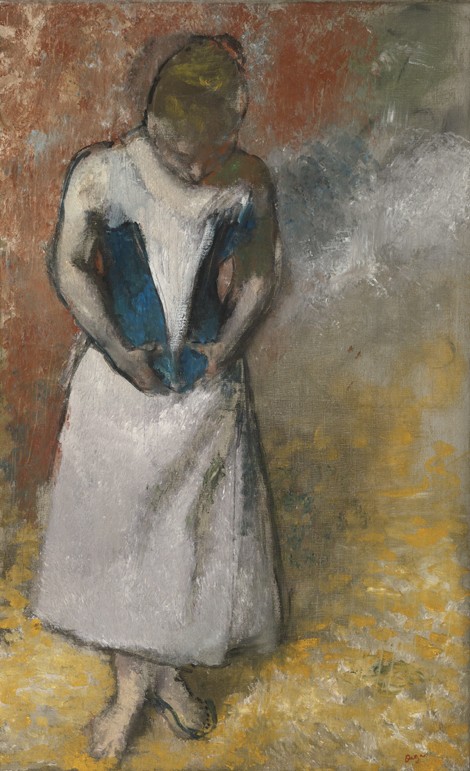 Woman standing from the front, clasping her corset de Edgar Degas