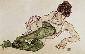 Reclining woman, green tights