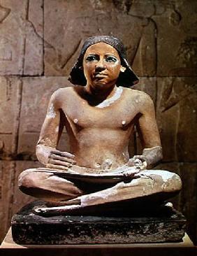 Scribe seated cross-legged holding a papyrus scroll, from Saqqara, Old Kingdom c.2475 BC