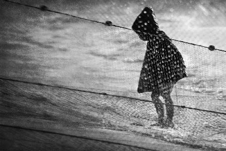 Rainy child at the sea