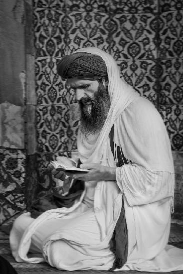 a man praying in the mosque