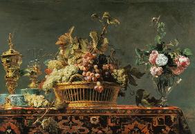 Grapes in a basket and roses in a vase