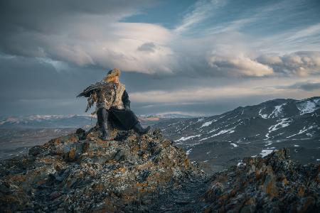 An Young Hunters and moody Altai Mountain range