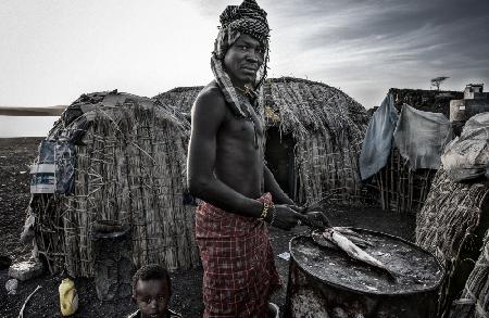 El Molo tribe man cleaning fish-Kenya