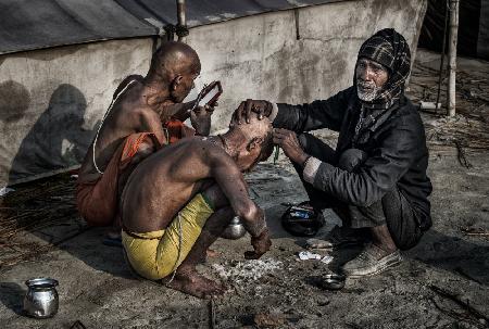 Shaving the head at a Kumbh Mela in Prayagraj-India