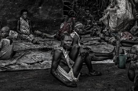 South Sudanian people having a rest near a market.