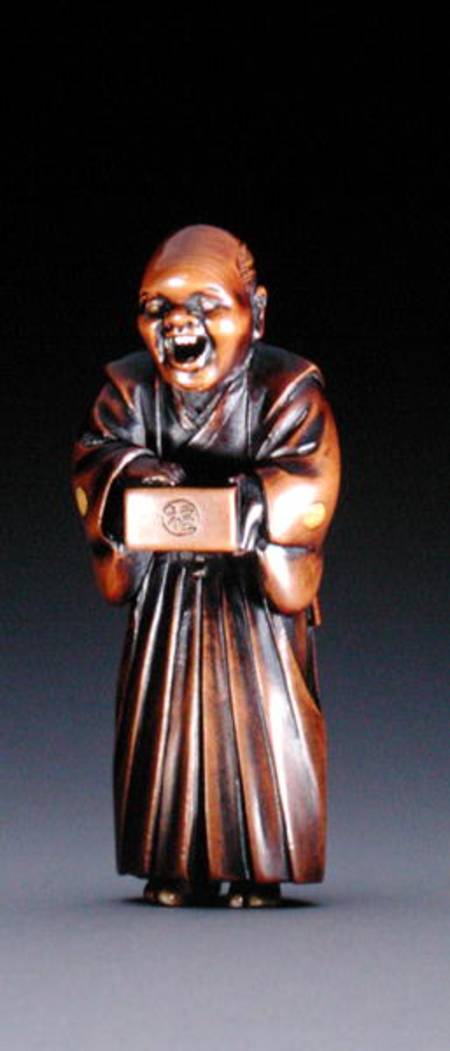 Netsuke depicting a standing priest de Miwa