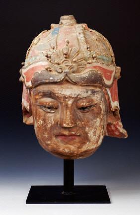 An Unusual Large Stucco Head Of A Guardian, 13th/14th Century