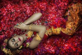 Balinese Woman Among The Flowers